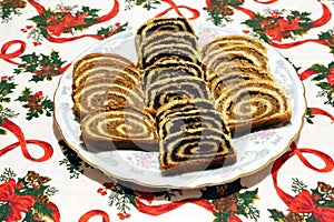 Traditional hungarian christmas sliced rolled cakes on table