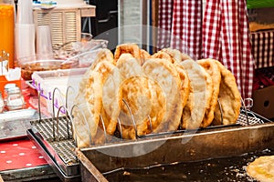 Traditional hungarian fried bread langos sold at a street vendor photo