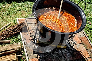 Traditional Hungarian goulash soup in the cauldron