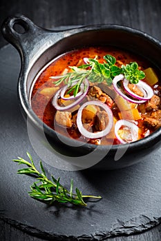 Traditional Hungarian goulash - stew of meat and vegetables with onions