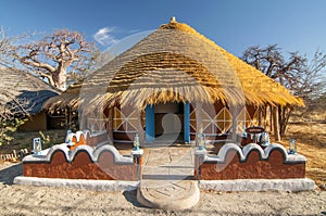 Traditional hut accommodation at Planet Baobab in Botswana, Africa