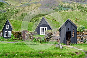 Traditional Icelandic House with grass roof in Skogar Folk Museum, Iceland photo