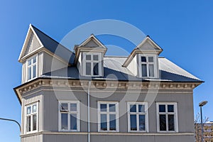 Traditional Icelandic residential ironclad house with gable roof, Reykjavik, Iceland. photo