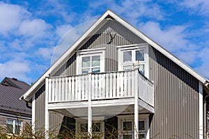 Traditional Icelandic residential ironclad house with gable roof, white window frames, Reykjavik, Iceland