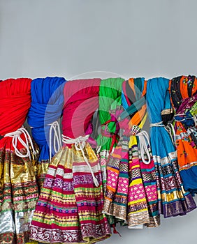 Traditional Indian costumes hung on the wall.