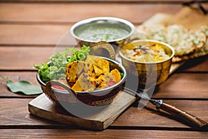 Traditional indian cuisine samosas  naan curry masala biryani rice kitchen towel panir tikka