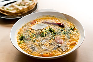 Traditional indian dal homemade. Traditional Indian soup lentils. Indian Dhal spicy curry in bowl with coriander and spices on