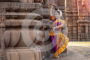 Traditional Indian Dance. Closeup view of indian Woman dancer wearing Traditional costume in the posture of Indian dance.