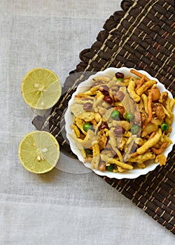 Traditional indian deep fried salty dish - chivda or mixture or farsan or namkeen chanachur made of gram flour and mixed with dry