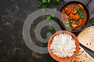 Traditional Indian dish chicken Tikka masala. Top view, copy space.