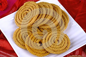 Traditional Indian Diwali snacks Chakali, murukku, Indian Traditional Tea Time Snack Chakli, Murukku, Muruku, Murkoo, Chakri,