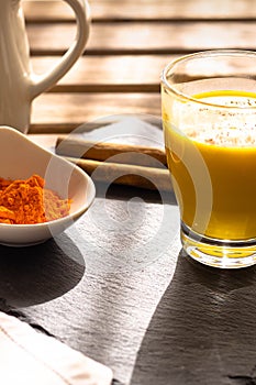 The traditional Indian drink turmeric milk is a golden milk with cinnamon for a healthy healing breakfast that prevents diseases