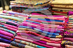 Traditional Indian fabric store. Colorful traditional indian hindi textile fabric wrap scarfs