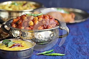 Traditional Indian home-cooked dinner. dishes of national Indian cuisine on a dark blue background. rice, dal, sabji, pakora. top