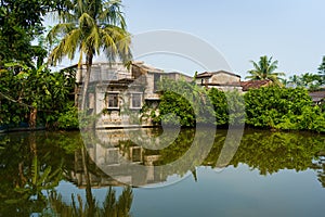 Traditional indian house and lakes and puddle seen in the indian Sundarbans, the largest mangroves forest in the world. Pristine