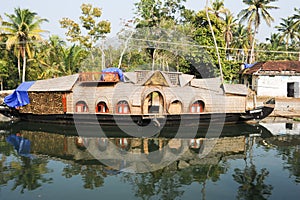 Traditional Indian houseboat cruising near Alleppey on Kerala ba