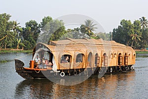 Traditional Indian houseboat cruising near Alleppey on Kerala ba