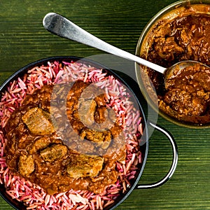 Traditional Indian Lamb Curry With Pink Pilau Rice