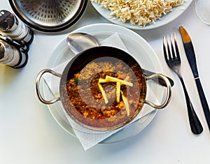 Traditional Indian lamb karahi curry white ginger and rice