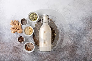 Traditional indian masala chai. Ingredients for spicy milk tea on concrete background. Food background. Top view, copy space