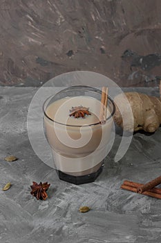 Traditional indian masala chai tea with ingredients.