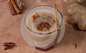 Traditional indian masala chai tea with ingredients.