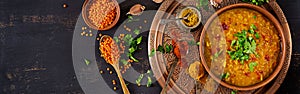 Traditional Indian soup lentils. Indian Dhal spicy curry in bowl, spices, herbs