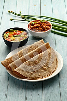 Traditional Indian street foods- fresh chapatti and curries