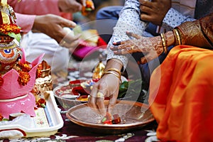 Traditional indian wedding ceremony, groom holding bride hand