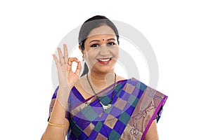 Traditional Indian Young woman making OK sign