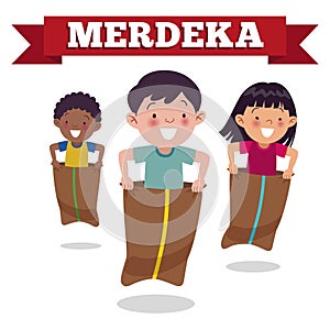 Traditional Indonesian special game on Independence Day, children race in sacks. Merdeka Day is Indonesian Independence Day. photo