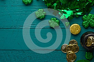 Traditional Irish holiday St. Patrick`s Day, March 17th celebration, with accessories for teething on a green wooden background