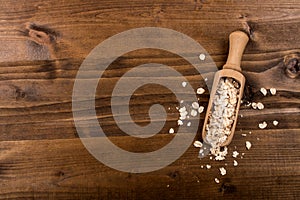 Traditional irish raw oatmeal in a wooden shovel