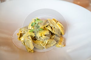 Traditional italian agnolotti pasta in a plate in a restaurant