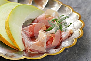 Traditional Italian appetizer parma ham with melon