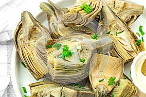 Traditional italian artichoke Â«alla romanaÂ», cooked carciofi vegetable. Olive oil, garlic, parsley