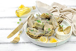 Traditional italian artichoke Â«alla romanaÂ», cooked carciofi vegetable. Olive oil, garlic, parsley