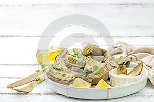 Traditional italian artichoke Â«alla romanaÂ», cooked carciofi vegetable. Olive oil, garlic, parsley