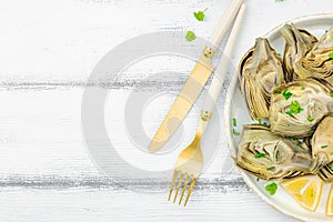 Traditional italian artichoke Â«alla romanaÂ», cooked carciofi vegetable. Olive oil, garlic, parsley