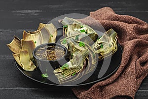 Traditional italian artichoke Â«alla romanaÂ», cooked carciofi vegetable. Olive oil, garlic, parsley