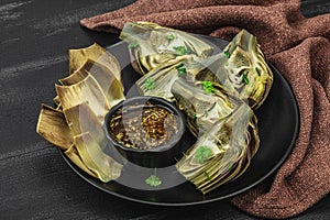 Traditional italian artichoke ÃÂ«alla romanaÃÂ», cooked carciofi vegetable. Olive oil, garlic, parsley photo