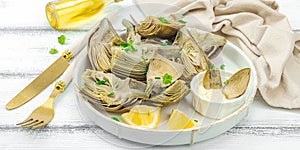 Traditional italian artichoke ÃÂ«alla romanaÃÂ», cooked carciofi vegetable. Olive oil, garlic, parsley photo