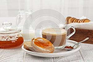 Traditional Italian Breakfast. Apricot Jam and Butter on Rusks or Fette Biscottate