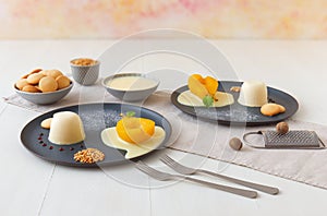 Traditional Italian dessert, panna cotta with poached pears and creme Anglaise