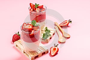 Traditional Italian dessert panna cotta with strawberry jelly. Summer yogurt dessert. Food recipe background. Close up