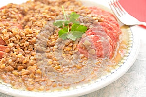 Traditional italian disch for last day of year pork sausage cotechino whit lentils