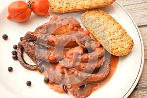 Traditional italian dish octopus luciana with tomato photo