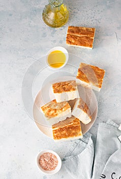 Traditional Italian focaccia bread with salt and olive oil. Homemade flat bread focaccia. Focaccia Genovese.