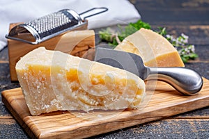 Traditional italian food - 36 months aged in caves Italian parmesan hard cheese from Parmigiano-Reggiano, Italy photo