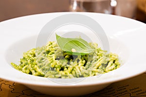 Traditional Italian food - trofie al pesto, typical regional pasta from Liguria region, basil sauce